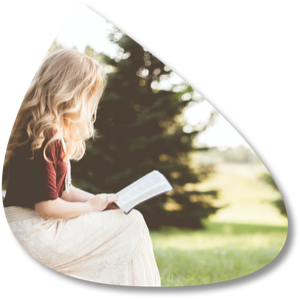 A woman reading in a field