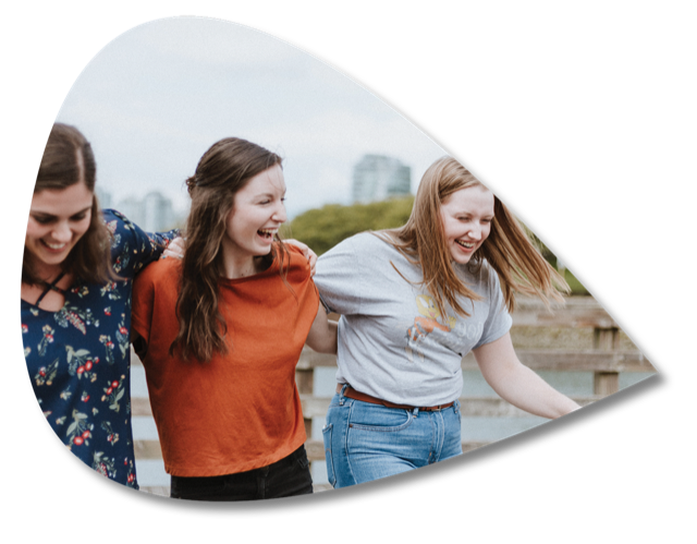 Three friends laughing together