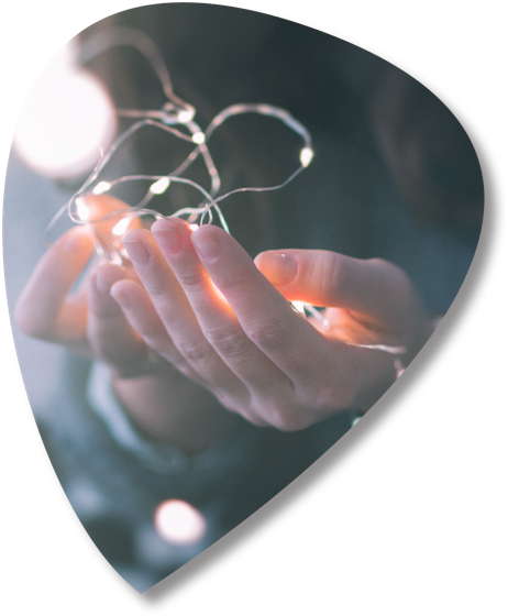 Hands holding a string of lights